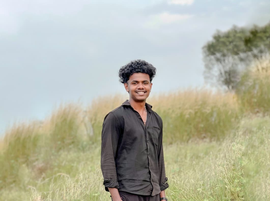 A digital marketing expert standing outdoors in a field.