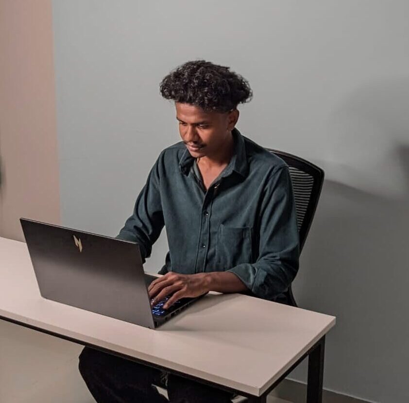 Professional digital marketing specialist working on a laptop at a modern desk setup