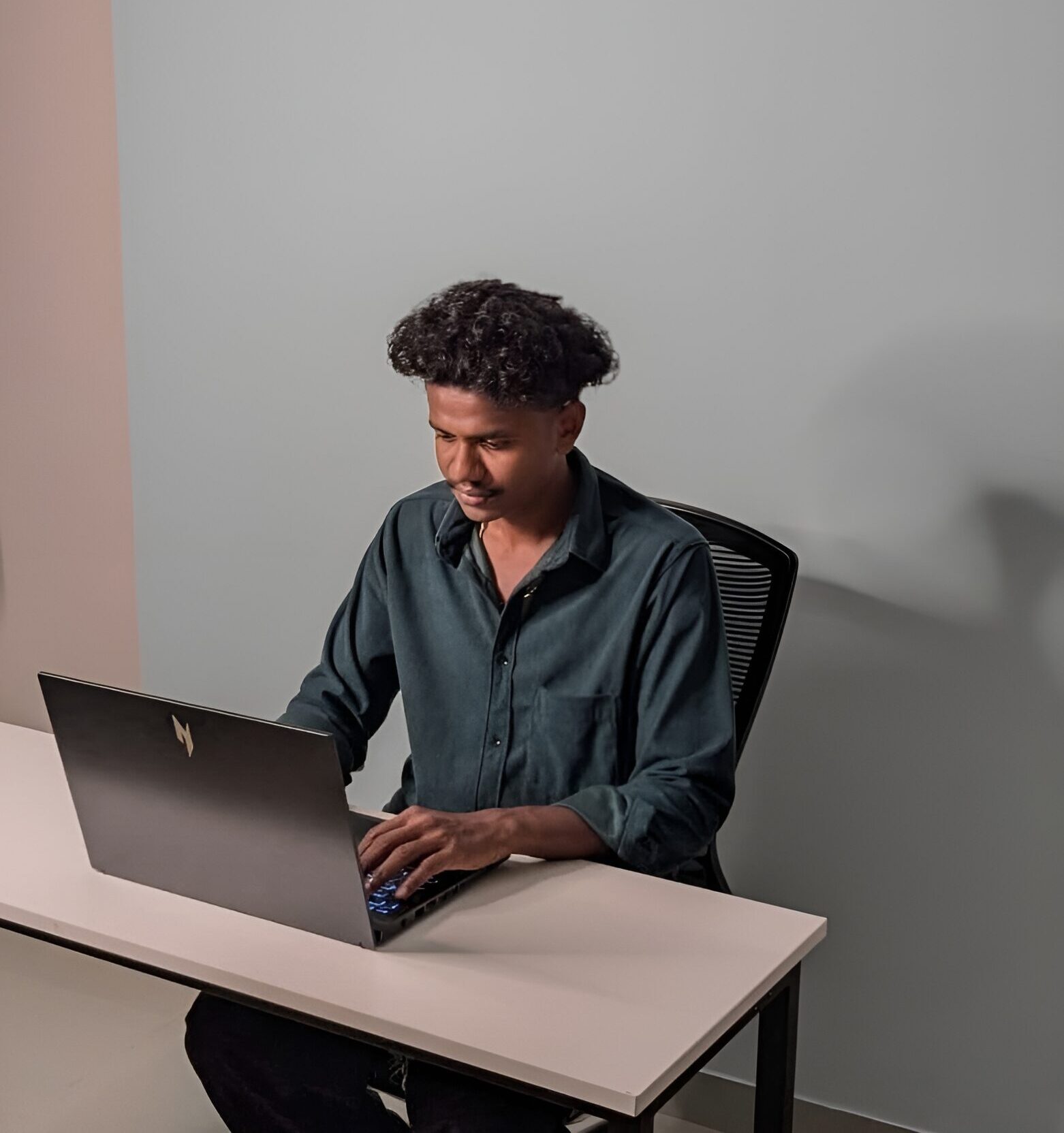 Professional digital marketing specialist working on a laptop at a modern desk setup